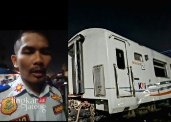 FOTO : IST/SS : Petugas Penjaga Jalan Lintasan (PJL) Madukoro, Agus Setiawan saat memberikan informasi terkait perkembangan kecelakaan antara KA Brantas vs Truk di perlintasan kereta api Madukoro Raya, Semarang, Selasa (18/7) jam 19.50 WIB.