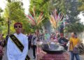 KIRAB: Kirab Tebokan Jenang yang menjadi daya tarik budaya di Desa Wisata Kaliputu, Kecamatan Kota, Kabupaten Kudus. (Nisa Hafizhotus.S/Lingkarjateng.id)
