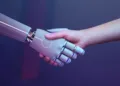 ILUSTRASI: Manusia berjabat tangan dengan robot. (rawpixel.com via magnific)
