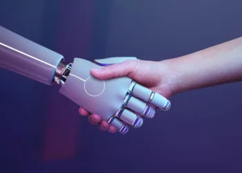 ILUSTRASI: Manusia berjabat tangan dengan robot. (rawpixel.com via magnific)