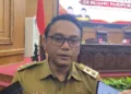 Pelaksana Tugas Bupati Pati, Risma Ardhi Chandra, usai menghadiri rpat paripurna di gedung DPRD Pati pada Senin, 14 September 2026. (Fahtur Rohman/Lingkarjateng.id)